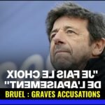Patrick Bruel : Sa tournée annulée face à de graves accusations 13 Portrait de Patrick Bruel sur scène, microphone en main