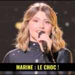 Marine The Voice : De la Star Academy au fauteuil rouge, ses doutes et son excitation 13 Marine, ancienne gagnante de la Star Academy, en tant que coach de The Voice, assise dans un fauteuil rouge.